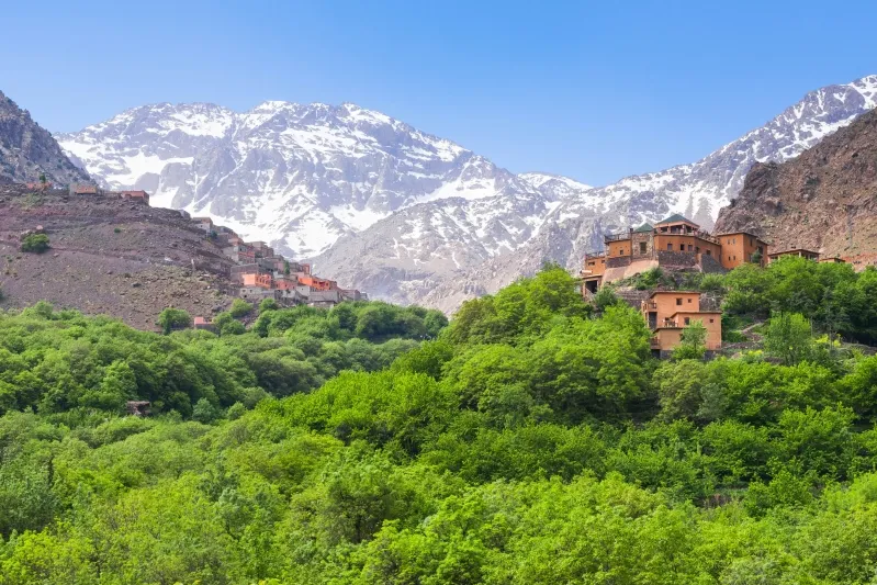 Scenic view of Atlas village nestled in the Moroccan mountains, showcasing its natural beauty and cultural charm. 