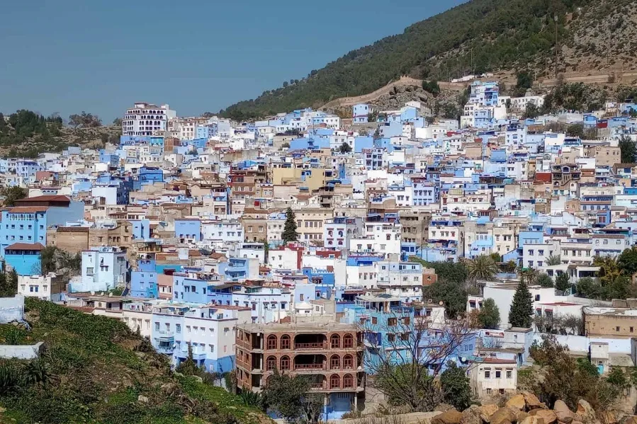 Scenic view of Chefchaouen, Morocco, showcasing its iconic blue buildings during a day trip from Spain.